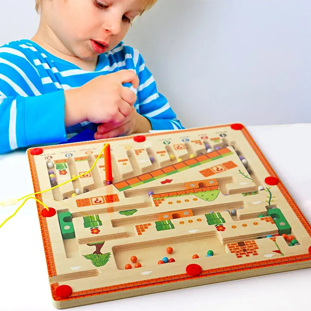 Child playing with the MagneticMaths wooden maze – building focus, colour recognition and fine motor skills through magnetic counting play.
