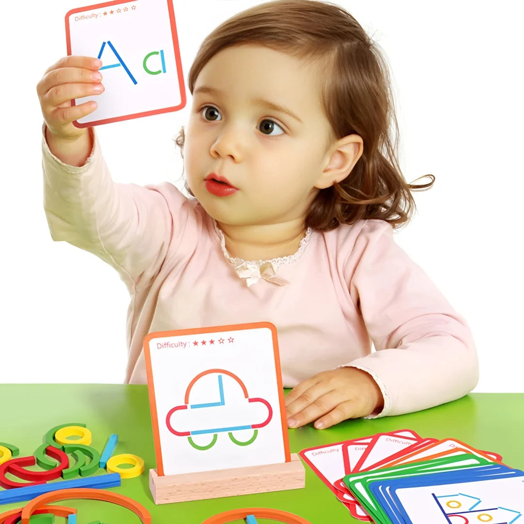 Child exploring ShapeCraft with colourful shape pieces and activity cards at a green table