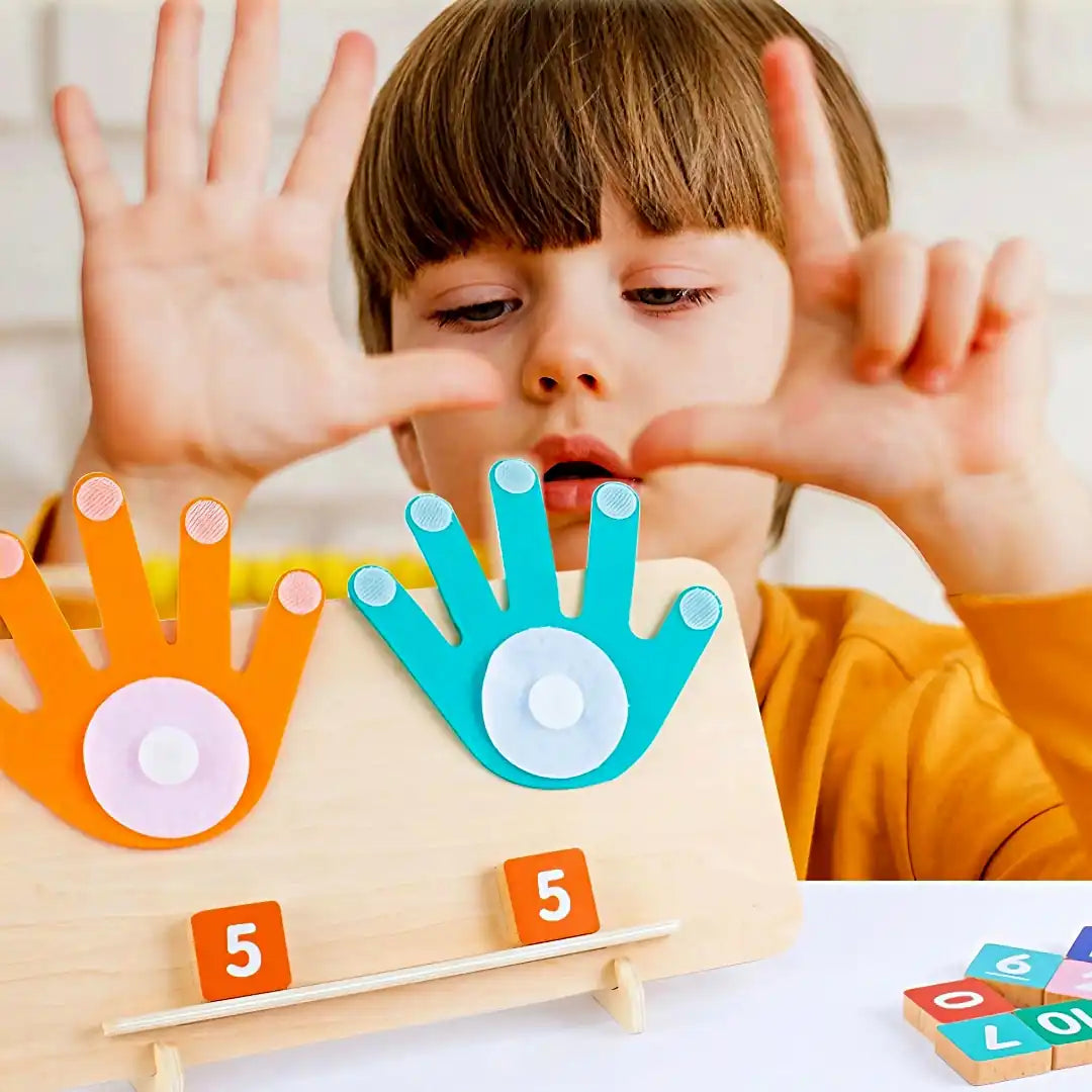 Child using TallyTots wooden number board with colourful felt hands to learn counting and number recognition through hands-on play