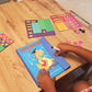 Child exploring the FractionHero learning set with magnetic fraction tiles and marker – a fun, hands-on way to understand fractions visually.
