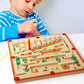Child playing with the MagneticMaths wooden maze – building focus, colour recognition and fine motor skills through magnetic counting play.