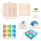 Complete Multiplay times tables set including 100 colourful wooden number tiles, multiplication board, dice, flashcards, and game pieces – all in one educational box.