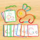 ShapeCraft bunny design made from colourful pieces with activity cards for letter and shape building on wooden surface